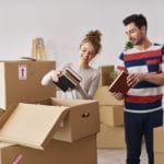 Young couple moving in to house